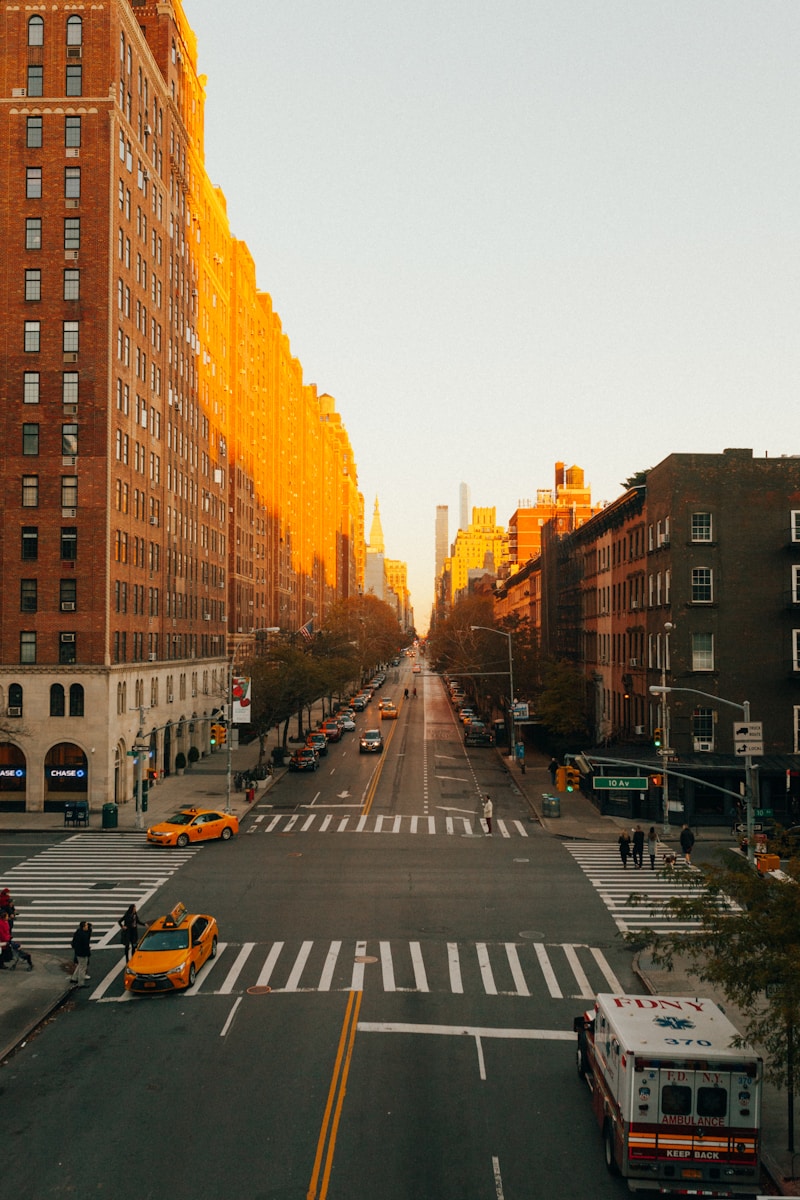 concrete road beside building during golden hour